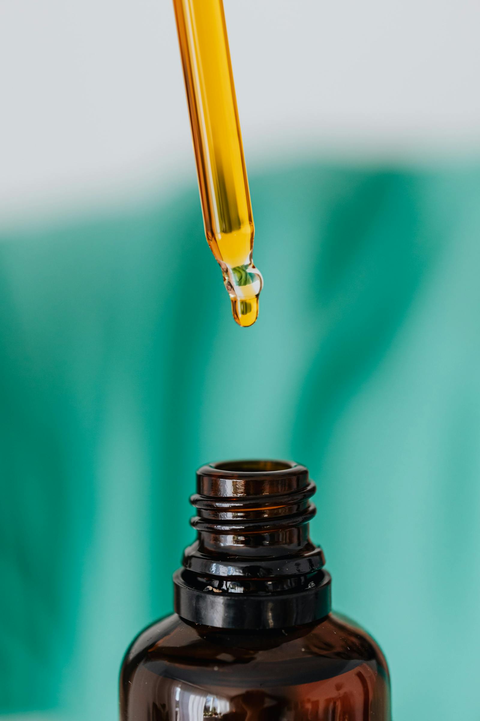 Amber dropper bottle representing the substances prohibited under EU Annex II cosmetic regulation