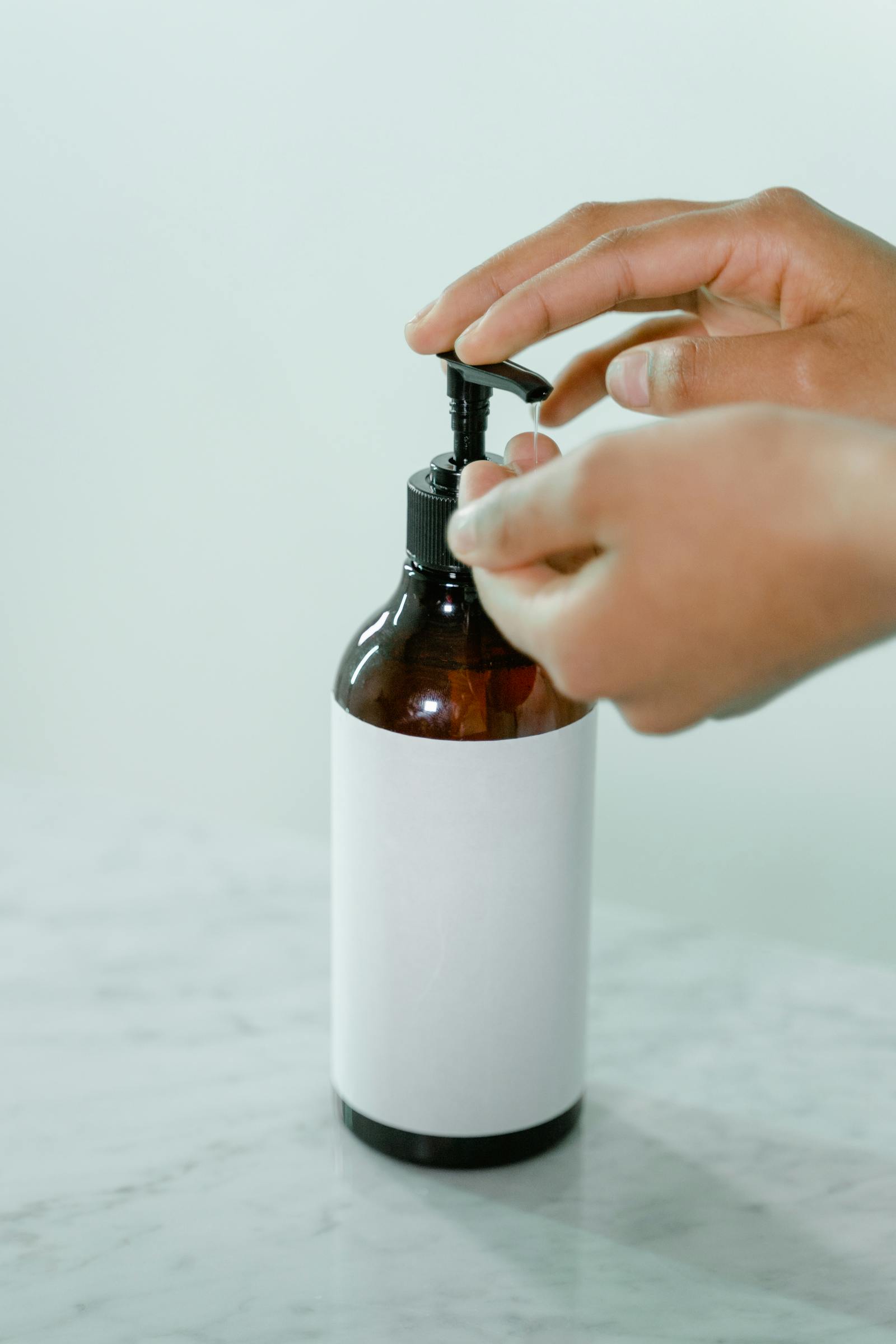 Pump-dispenser bottle of glycolic acid exfoliant representing a typical AHA leave-on formula