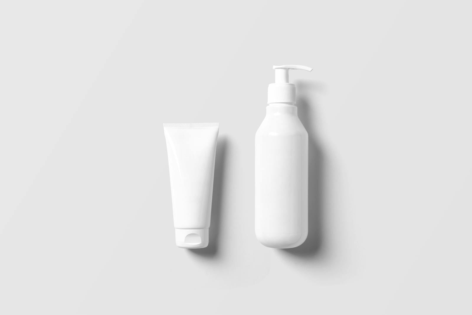 White shampoo bottle and cream tube on a clean surface, the rinse-off category where methylisothiazolinone is still permitted under EU limits