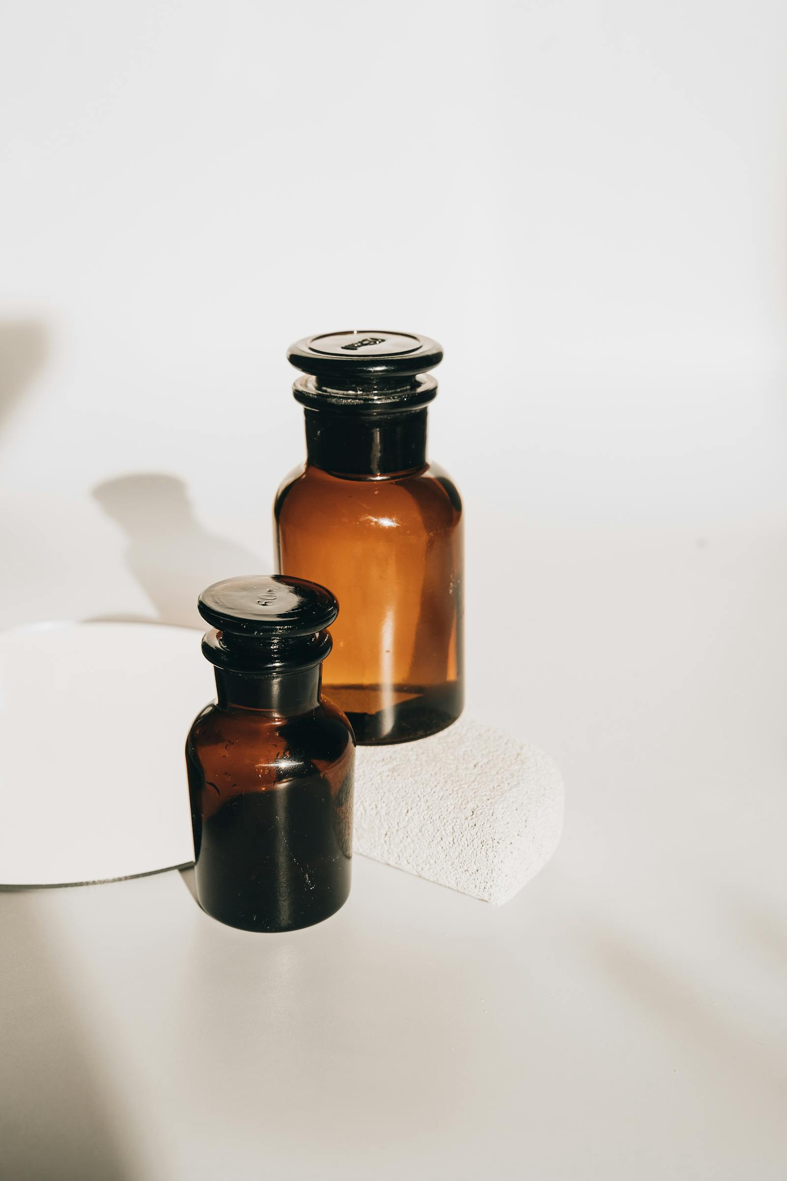 Amber glass dropper bottles representing the retinol family of vitamin A derivatives