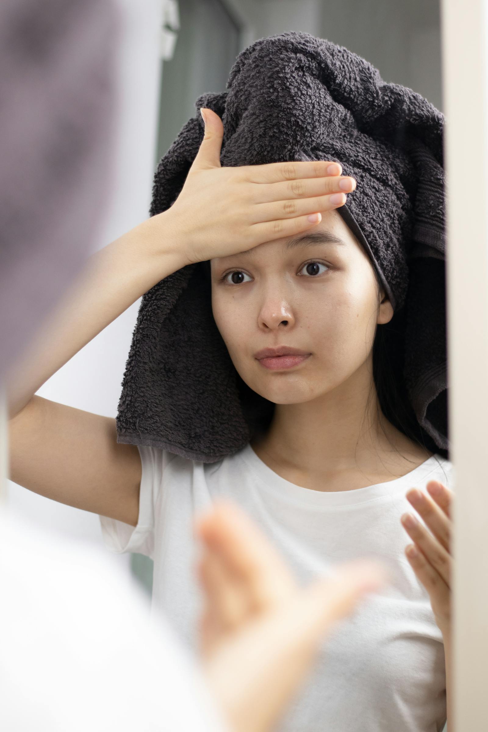 Woman with refreshed barrier-rebuilt skin on a recovery night of her skin cycling routine