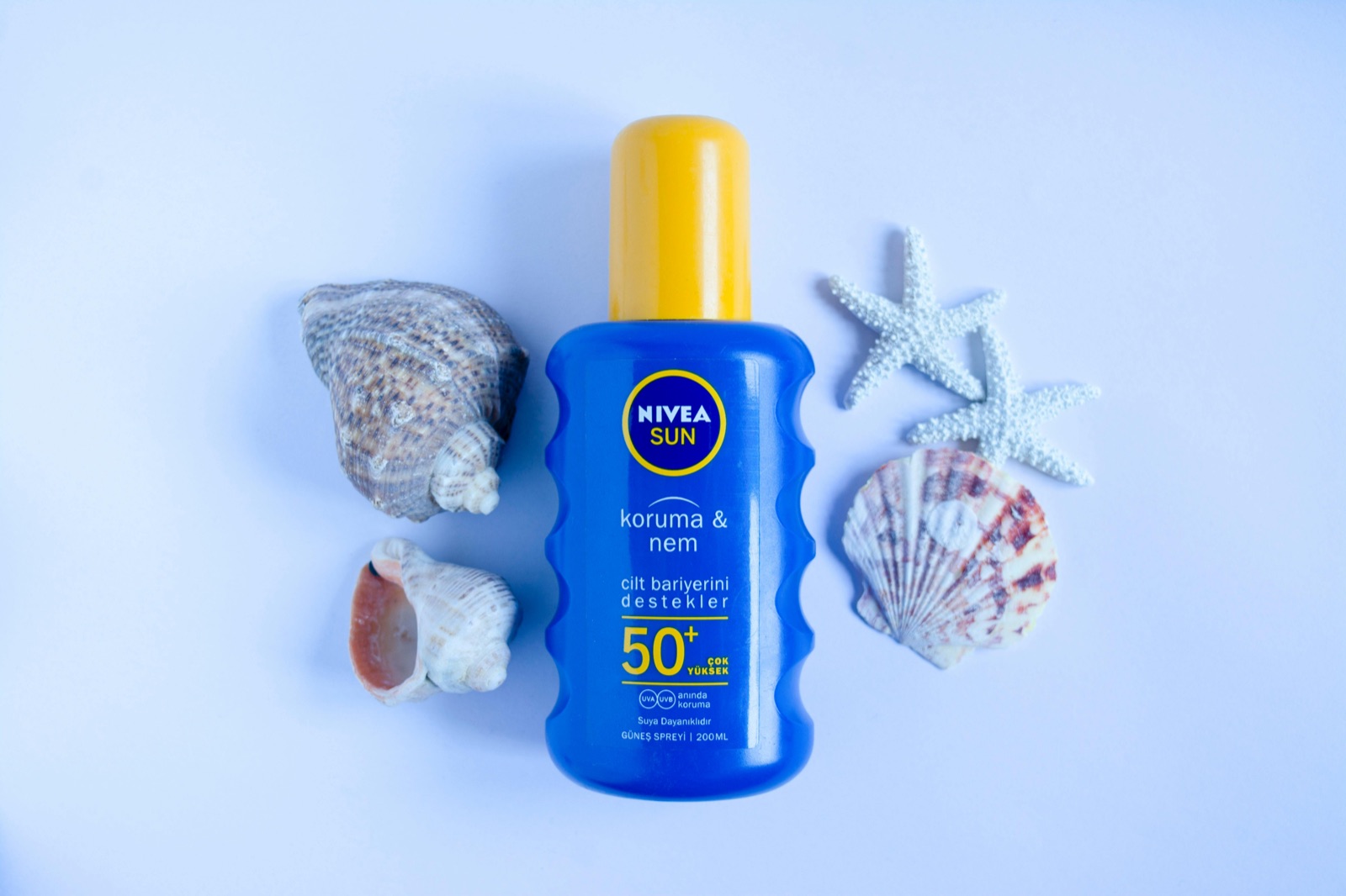 Mineral SPF 50 sunscreen bottle representing zinc oxide and titanium dioxide UV filter formulations