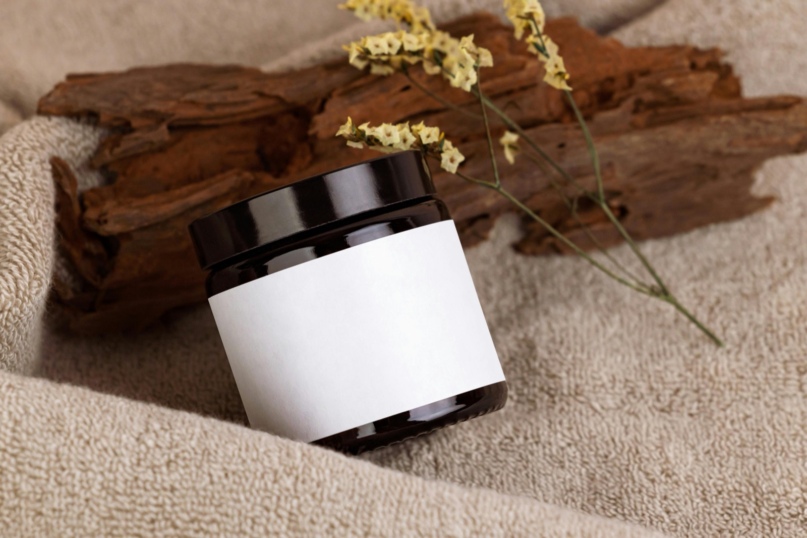 Minimalist cosmetic jar with a blank label representing the standardised INCI naming system on every skincare product